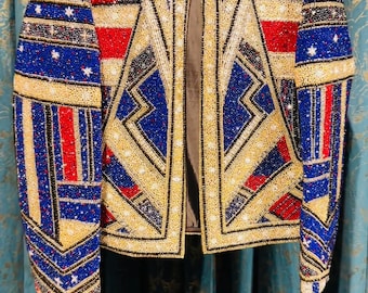 This black ZARA Trafaluc jacket features an intricate geometric pattern made of red, blue, and gold sequins Full heavy  jacket