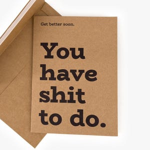 May include: A brown greeting card with the text "You have shit to do" in bold black letters. The card is inside a matching brown envelope. The words "Get better soon" are printed above the main text.