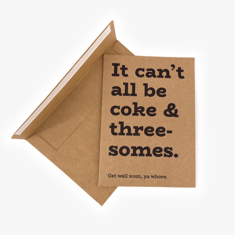 May include: A brown greeting card with the text "It can't all be coke & threesomes." and "Get well soon, ya whore." in black. The card is inside a matching brown envelope, partially open.