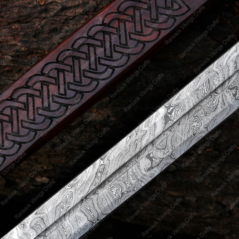 May include: Close-up of a sword with a detailed design. The blade has a marbled pattern, while the handle features a dark wood with an engraved Celtic knot design. The sword's design suggests a historical or fantasy theme.