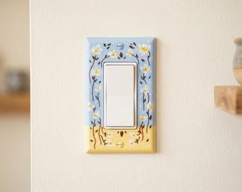 Ręcznie malowany talerz z motywem kwiatowym, dekoracja ścienna z maślano-żółtymi, niebieskimi stokrotkami