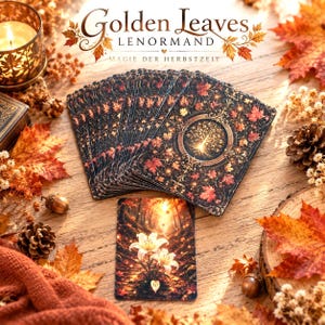 Può includere: Un mazzo di carte Golden Leaves Lenormand con sfondo scuro, foglie autunnali arancioni e rosse, un'illustrazione centrale di un albero e una carta con gigli bianchi. Il testo recita Golden Leaves LENORMAND MAGIE DER HERBSTZEIT.