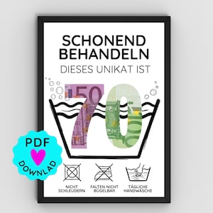 May include: A framed print with German text and a graphic of a washing machine containing the numbers "70" made of Euro banknotes. Below are laundry symbols. A PDF download icon is in the lower left corner. The text reads "SCHONEND BEHANDELN DIESES UNIKAT IST".