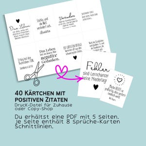 May include: A white card set with positive quotes in German. The cards feature black text on a white background, with a heart graphic. The text includes quotes from Buddha, Johann W. Goethe, and Norman V. Peale. The set includes 40 cards.