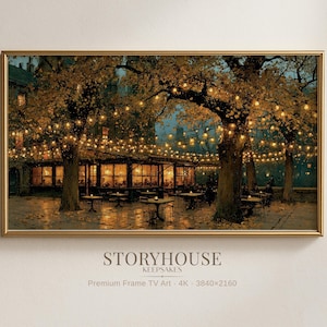 May include: A rectangular framed wall art print depicting an outdoor evening scene with a restaurant terrace illuminated by warm string lights hanging between large trees. The text STORYHOUSE KEEPSAKES Premium Frame TV Art 4K 3840x2160 is visible.
