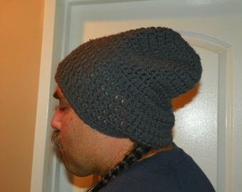 May include: A dark gray crocheted beanie hat with a slouchy fit.