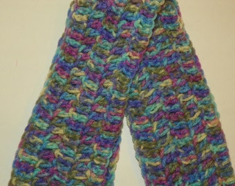 May include: A crocheted scarf in a multi-colored pattern of green, blue, purple, and beige.