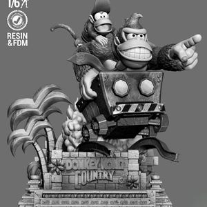 May include: A grayscale resin statue of Donkey Kong and Diddy Kong from Donkey Kong Country. The statue features the two characters on a vehicle, with the Donkey Kong character pointing. The base of the statue has the words "Donkey Kong Country".