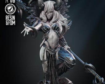 May include: A detailed resin figurine of a female fantasy character with large feathered wings, horns, and intricate armor. The figure is posed dynamically, holding a staff, with a dark, gothic aesthetic. The base includes a tombstone.