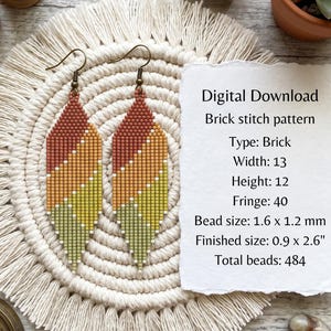 May include: A pair of diamond-shaped beaded earrings featuring a diagonal gradient of rust, orange, yellow, and light green. The text on the paper reads: Digital Download, Brick stitch pattern, Type: Brick, Width: 13, Height: 12, Fringe: 40, Bead size: 1.6 x 1.2 mm, Finished size: 0.9 x 2.6 inches, Total beads: 484.
