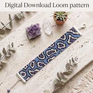 May include: A beaded loom bracelet featuring a blue, dark blue, and white leopard print pattern. The bracelet has silver-toned metal end bars, a lobster clasp, and an extender chain. Text on the image reads: Digital Download Loom pattern. Width: 17 beads, Height: 87 beads, Total beads: 1479.