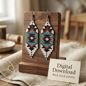 May include: A pair of beaded earrings with a geometric pattern in turquoise, red, black, and white. The earrings are displayed on a wooden stand. A small card reads "Digital Download Brick stitch pattern".
