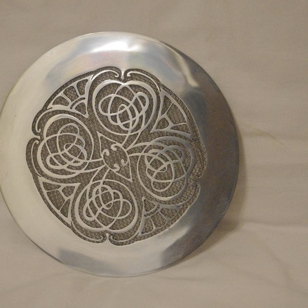 round vent cover from polished zinc with Celtic ornament