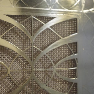 solid brass cover with art deco pattern
