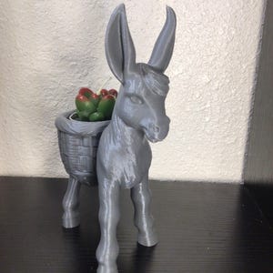 Little donkey with cactus tea light candle.