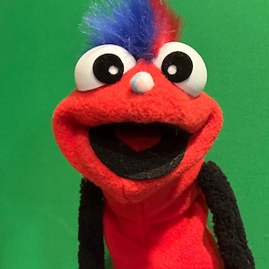 Child sized/ small fit red sleeve puppet.