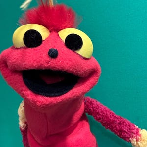 Child sized/ small fit red sleeve puppet.