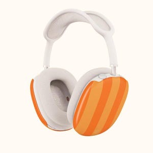 May include: White and orange striped over-ear headphones. The earcups have an orange and white striped design, with white ear pads and a white headband. The headphones are designed for comfort and style.