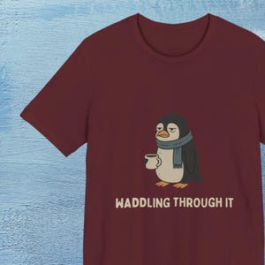 Cute Penguin Tee - Waddling Through It, Fun Graphic T-Shirt, Gift for Animal Lovers, Cozy Casual Wear, Gift for Her, Sad Animal Shirt