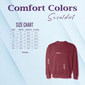 Op de afbeelding: Een bordeauxrood Comfort Colors sweatshirt met een maattabel. De maattabel toont de afmetingen in inches voor breedte, lengte en mouwlengte. De sweatshirt is effen van kleur met een ronde hals.