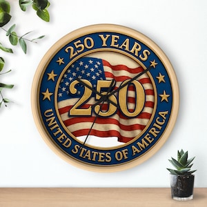May include: A round wall clock with a wooden frame. The clock face features the American flag and the text "250 YEARS UNITED STATES OF AMERICA" in gold lettering. The clock hands are black.