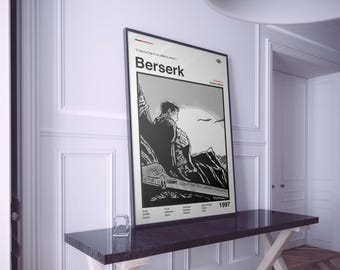 May include: A framed black and white poster with the title "Berserk". The image shows a manga scene of a person overlooking a mountain range. The year "1997" is printed at the bottom of the poster.
