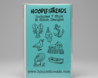 May include: A teal package labeled Hooplethreads includes 7 stick and stitch designs featuring black line art illustrations of a lobster, buoys, an anchor, a seagull, a coastal building, an oyster, and a boat with the text Shuck it.