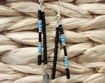 Black and turquoise glass seed bead handmade earrings featuring silver feather charms