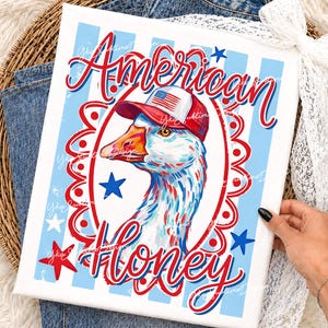 May include: A canvas print featuring a goose wearing a red, white, and blue hat with an American flag design. The words "American Honey" are written in red and blue script, surrounded by stars and stripes.