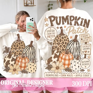 May include: A white long-sleeve sweatshirt featuring a graphic print of various pumpkins with leopard, cow, and plaid patterns. The text reads PUMPKIN PATCH, FRESH FROM THE PATCH, FARM FRESH, LOCALLY GROWN, AUTUMN PICKED, PUMPKINS, CORN MAZE, APPLE CIDER.