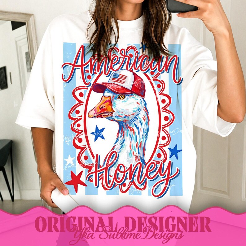 May include: White t-shirt featuring a patriotic design. The graphic includes a goose wearing a red, white, and blue hat, with the words "American Honey" in a decorative font. Red and blue stars and stripes complete the design.