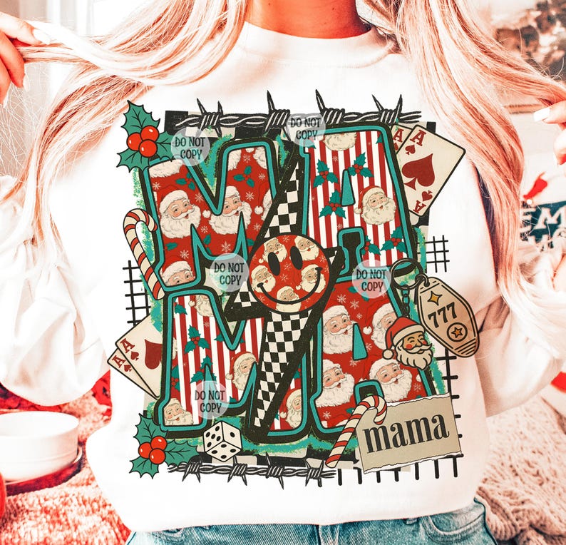 May include: White sweatshirt with a graphic design featuring the word "MAMA" and a smiley face. The design incorporates Santa Claus, playing cards, candy canes, and the number 777. The words "DO NOT COPY" are also visible.