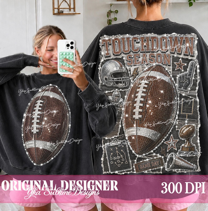 May include: A black crewneck sweatshirt featuring a large graphic of a brown American football on the front. The back displays a detailed collage with the text TOUCHDOWN SEASON, a football helmet, a football, and a play diagram in white.