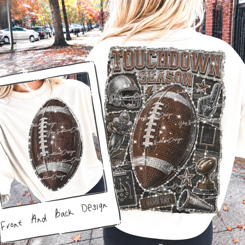 May include: A cream-colored t-shirt featuring a brown football graphic on the front and a large "TOUCHDOWN SEASON" graphic on the back. The back design includes a football, helmet, player, trophy, megaphone, and play diagram with glitter-like accents.