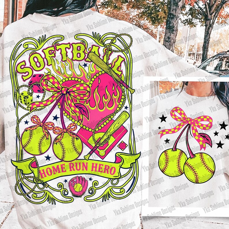 Puede incluir: Sudadera blanca con un dise&ntilde;o vibrante de softbol. Presenta la palabra "SOFTBALL" en verde ne&oacute;n, un coraz&oacute;n rosa con llamas, pelotas de softbol, bates y el texto "HOME RUN HERO".