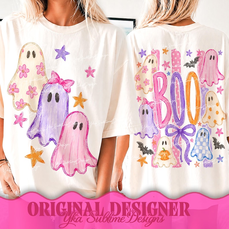 May include: An off-white t-shirt featuring a graphic print of multiple ghosts in various colors and patterns, including floral, solid, and checkered designs, accented with stars, a bow, and the word BOO in large, colorful, hand-drawn style lettering.