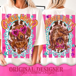 May include: Cream-colored t-shirt featuring a dachshund wearing heart-shaped glasses. The front design says "Guess What?" and the back says "Wiener Butt!" in orange and pink. The design includes a pink and blue border with stars.