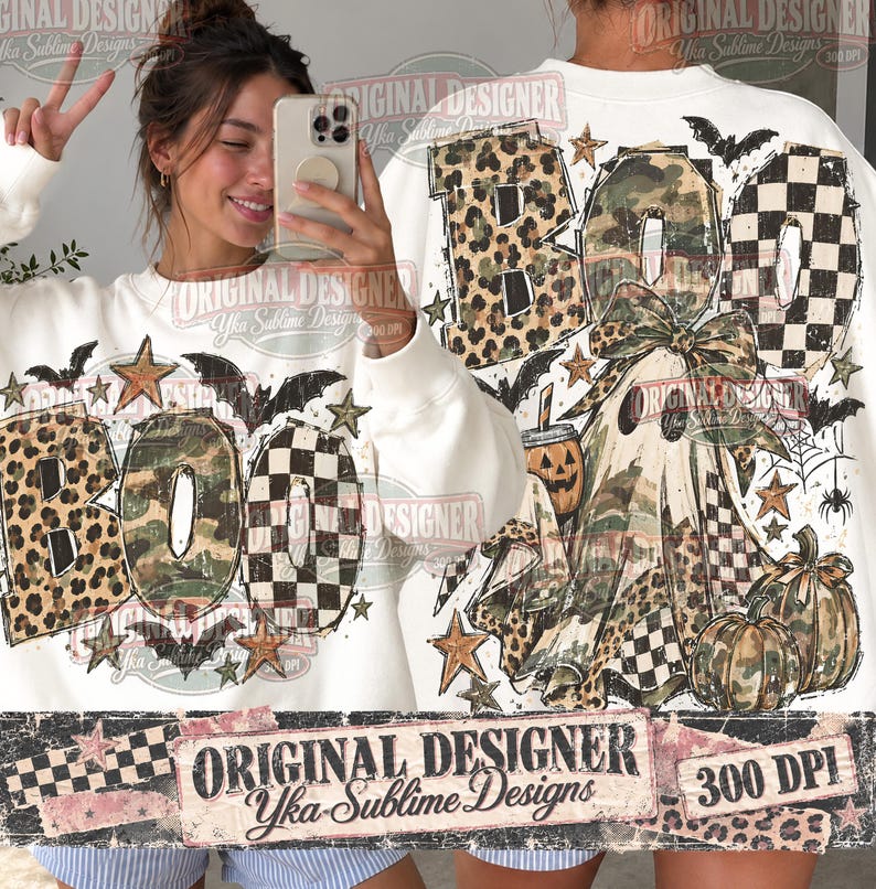 May include: A white sweatshirt featuring a large graphic print of the word BOO in leopard, camouflage, and checkered patterns. The design includes a ghost, pumpkins, bats, stars, and a spider web. The text Original Designer Yka Sublime Designs 300 DPI is visible.