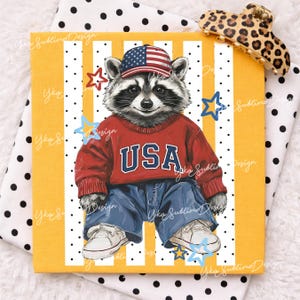 May include: A square canvas print featuring a raccoon wearing a red sweater with "USA" in white letters, blue jeans, and a baseball cap with the American flag. The background is yellow with white stripes and black polka dots. Blue and gold stars are scattered around the raccoon.