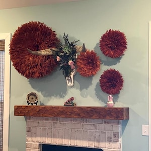 Handmade Rust Juju Hat Wall Decor. Terracotta African Feather Art