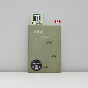 Pode incluir: Um livro de capa dura verde com texto em língua estrangeira. A capa apresenta um design minimalista de dois pássaros em um fio. Um adesivo com a marca "Tlysta" está preso no topo do livro. Uma bandeira canadense também é visível.