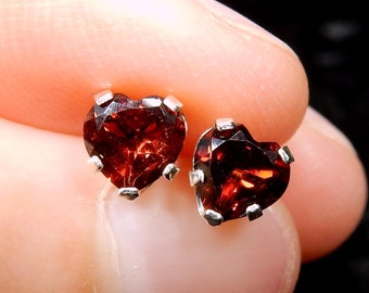 Dark red garnet hearts in sterling silver ear studs - the birthstone for January