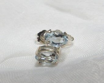 Clear blue aquamarine set in sterling silver basket style ear studs