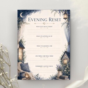 May include: A rectangular paper sheet titled Evening Reset with lined sections for writing. The design features a night scene with a crescent moon, hanging lanterns, blue curtains, a cozy nook with a pillow, and a vase of lavender flowers.