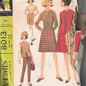 May include: Vintage sewing pattern for separates for three figure types: misses, teen and pre-teen. The pattern is McCall's 8013 and is for sizes 14-16 with a bust size of 34-36 inches. The pattern features three different outfits, each with a skirt, top, and jacket.