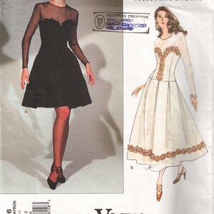 May include: A vintage sewing pattern for two dresses. The first dress is black with a sheer overlay and the second dress is white with gold embroidery. The pattern is from Vogue Patterns and is designed by Givenchy.
