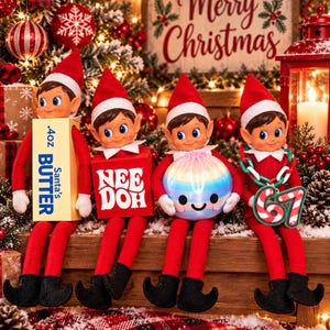 May include: Four elf dolls wearing red outfits and hats sit in a row. The first holds a yellow box labeled .4oz Santa's BUTTER, the second a red box labeled NEE DOH, the third a round iridescent ball, and the fourth a candy cane necklace with the number 67.