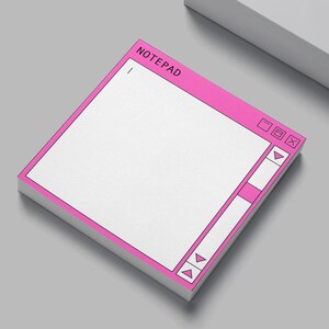 May include: A square notepad with a pink border and the word "NOTEPAD" at the top. The notepad design mimics a computer window, with a white interior and pink control buttons. The notepad is on a gray surface.