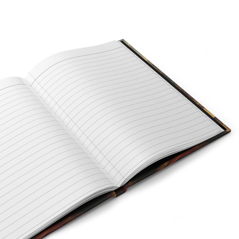 May include: An open lined journal with a decorative cover. The pages are white with gray lines. The cover has a dark, patterned design with shades of brown, black, and gold. The journal is angled, showing the interior pages and the cover's edge.