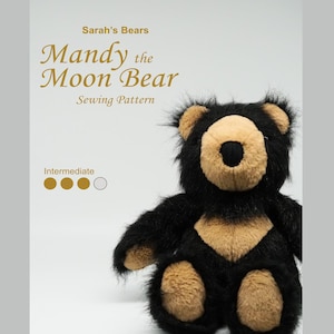 May include: A plush black bear with tan fur accents on the ears, muzzle, chest, and feet. The text reads Sarah's Bears Mandy the Moon Bear Sewing Pattern with an intermediate skill level indicator consisting of three filled and one empty circle.